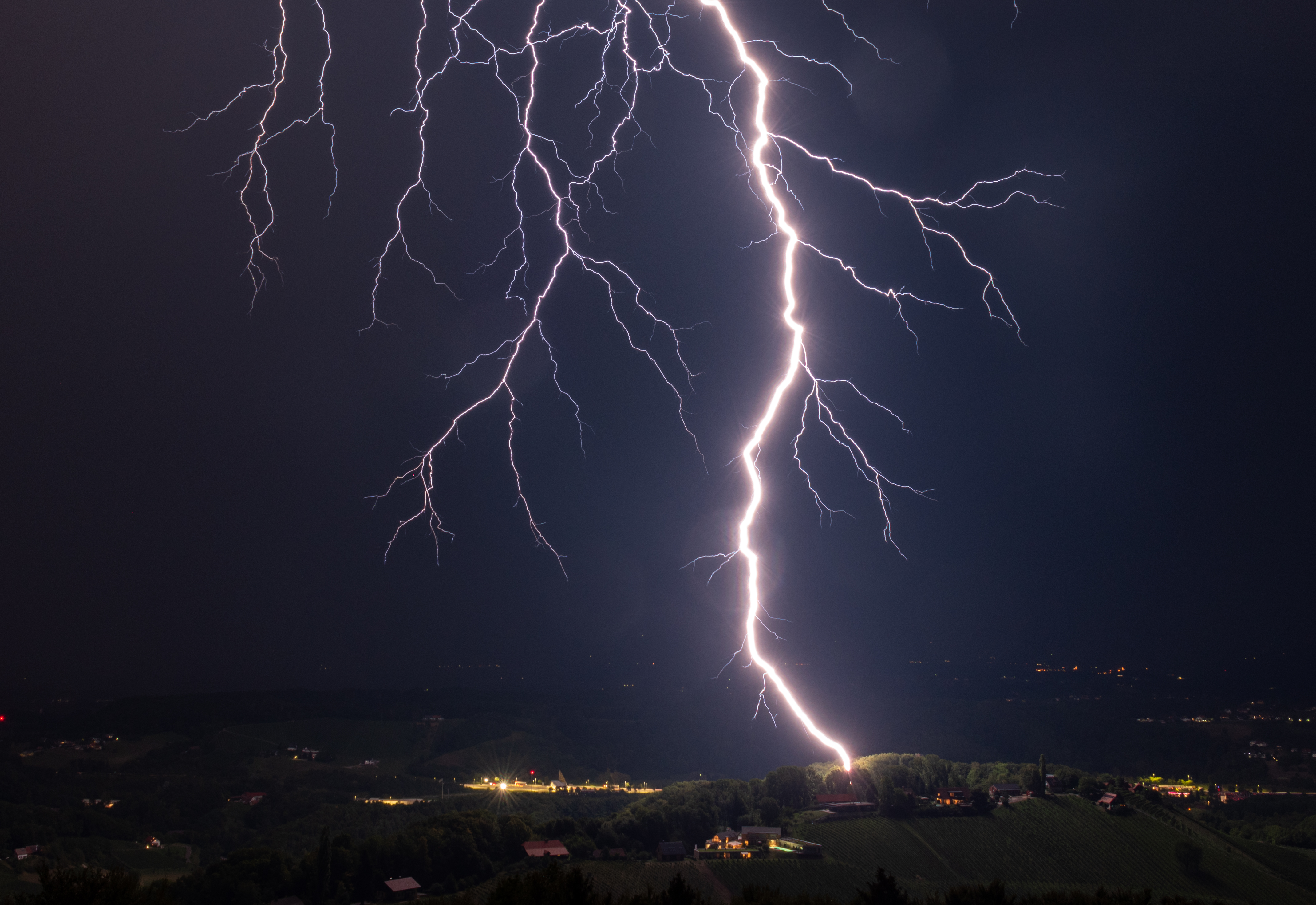 Night lightning over hills